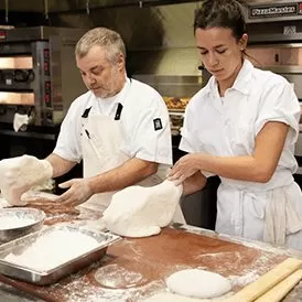 Chefs-making-fresh-pizza-bases